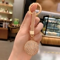 Champagne crystal ball keychain with sparkling rhinestones and gold ring strap - Pink