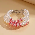Detail view of triple-strand white pearl bracelet with red accents and silver lobster clasp - 3-Layer Beaded / Bracelet-Red