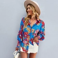 Women's blue floral long lantern sleeve shirt with vibrant red and yellow patterns - S / Blue