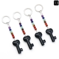 Set of four black heart key-shaped natural stone keychains with colorful chakra beads - Obsidian