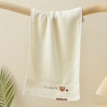 Detailed embroidery of a bear and Goodluck text on soft cream cotton children towel - Embroidered Bear Head Beige