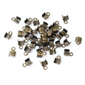 Vue macro de fermoirs et embouts de cordon en métal bronze pour la création de bijoux DIY - 3mm (200 Pièces) / Bronze