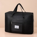 Foldable black quilted travel bag with large capacity and trolley sleeve feature - Black