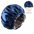 Detail of double-layer satin sleep bonnet featuring a navy outer and beige silk lining - Navy Blue