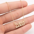 Detailed shot of the gold year necklace with 2008 number pendant on a fine link chain - 2008 / Gold