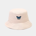 Close-up detail of blue and black butterfly embroidery on beige canvas bucket hat - Beige