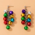 Close-up of festive Christmas drop earrings with colorful bells on silver chains - Multicolor Bell Cluster