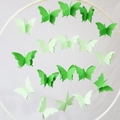 3D gradient paper butterfly garlands hanging from a white ring for party decoration - L Green