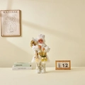 Standing Santa Claus figurine in white and gold robes with a gold gift bag, 45cm - 45cm