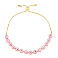 Close-up of pink evil eye beads and adjustable slider clasp on golden bracelet - Pink
