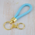 Handmade light blue braided leather keychain with elegant gold tone metal hardware - Generation 1 Round Dragon Woven Buckle (Light Gold) / Light Blue