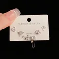 Detail of S925 silver needle earring set featuring heart, butterfly, and cross shapes - Silver-Irregular Heart Planet Set (68#)