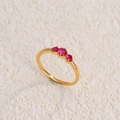 Minimalist gold titanium steel ring with three round red zircons on textured stone - Gold Plated Rose Red Zirconia