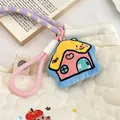 Detail of cartoon house plush charm with embroidery on a white quilted bag - House