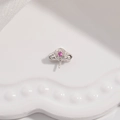 Macro shot of silver S925 floral pendant setting with pink gemstone on white tray - Style A / White Gold