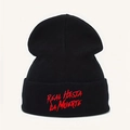 Black beanie featuring red Real Hasta La Muerte embroidery with clear knit texture - Black with Red Letters
