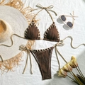 Flat lay of brown ribbed bikini set with beige rope details and summer vacation props - Dark Brown