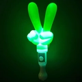 Close-up of green glowing V-shaped LED hand gesture wand with white plastic handle - Heart Gesture Finger Wand Green