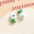 Detailed view of colorful 3D fish eye beads for DIY jewelry making on white ceramic plate - 3D Color Matching Fish / Evil Eye Multi-color