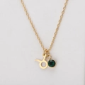 Golden Taurus zodiac necklace featuring a green birthstone pendant on a fine link chain - Gold-Taurus