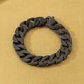 Matte black Cuban link stainless steel bracelet with large lobster clasp on yellow background - Brushed Black (KB49340-D)
