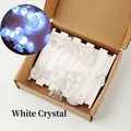 Natural white crystal raw stone USB LED string light in a cardboard packaging box - Clear Quartz Tumbled Stones String Light - 2m Flat Switch