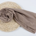 Brown chiffon hijab scarf with fine edges displayed in a spiral on a woven mat - 116