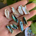 Handheld view of natural baroque pearl and abalone shell pendants with gold plated edges - No.28 Multi-color Width 7-13mm Length 18-28mm