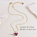 Detail shot of purple glass butterfly pendant on a gold stainless steel chain necklace - Necklace-Butterfly
