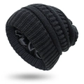 Detail of black knit beanie featuring a smooth satin lining for hair protection - One Size / Black