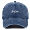 Detailed close-up of white Bride embroidery on a washed navy blue denim baseball cap - Adjustable / Navy Blue