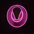 Top view of vibrant neon pink LED cowboy hat with glowing lines on dark background - Adult Wireless-White Pink
