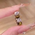 Eleganter versilberter offener Ring mit ovalen Zirkonia und braunen Tigeraugen - Hellkaffeegold