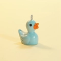 Light blue luminous resin duck pendant with silver metal ring on yellow background - Solid Light Blue (Silver Pin)
