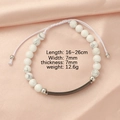 Detailed close-up of white marble bead bracelet with adjustable cord and silver metal plate - White Turquoise + Black Plate