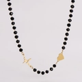 Detail of beaded necklace featuring golden heartbeat and heart shaped charm pendants - EKG & Heart