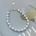 Elegant silver beaded bracelet with heart pendant and lobster clasp on grey background - Cat Eye Bracelet (SL144)