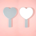 Gray heart-shaped hand mirror with smooth handle shown from both sides - Gray