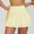 Light yellow high-waisted pleated tennis skirt featuring a built-in liner for sports - S / Creamy Yellow