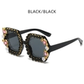 Occhiali da sole esagonali neri con strass rosa e piccoli fiori bianchi decorativi - Nero