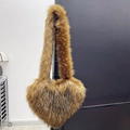 Faux raccoon fur heart-shaped crossbody bag in fluffy brown and black mixed plush tones - Coffee