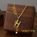 Titanium steel gold necklace with H letter pendant and tassel on wooden stand - Letter H / Gold