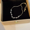 Adjustable golden starburst bracelet with clear cubic zirconia in a black gift box - Gold Heart