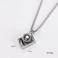 Detail view of retro silver camera pendant necklace with dimensions 24mm x 17mm and 48g weight - Vintage Camera Style (6)
