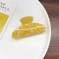 Chic acetate hair claw clip featuring a unique yellow and white marble pattern finish - Small Semi-circular Yellow