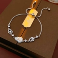 Macro view of adjustable silver bracelet with pearl inlaid gourd charms and pavé zircon stones - Silver-Blue (18K Gold Plated)