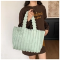 Detail showing plush mint green striped faux fur texture on a large shoulder tote bag - Emerald Green