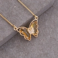 Macro shot of 18K gold butterfly necklace with yellow crystals on stone background - Yellow