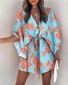 Detail of V-neck floral summer dress showing sky blue fabric and orange flower patterns - S / Light Blue