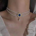 Double-layer pearl necklace with a vintage blue gemstone and gold-plated center pendant - Vintage Cat's Eye Stone Artificial Pearl Necklace (X1835) / Blue